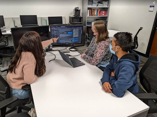 Faculty working with students at the Computational Intelligence Lab